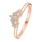 Rose gold ring with diamond accents on a white background