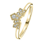 Gold ring with diamond accents on a white background