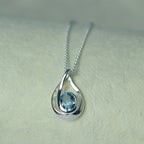 Silver Swirl Blue Topaz Pendant