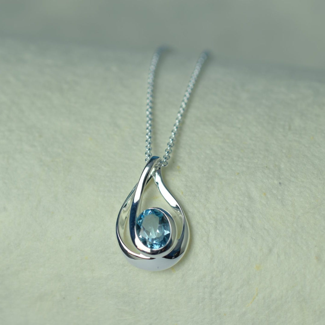 Silver Swirl Blue Topaz Pendant