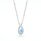 Silver Ribbon Blue Topaz Pendant