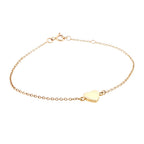 Gold bracelet with a heart-shaped charm on a white background